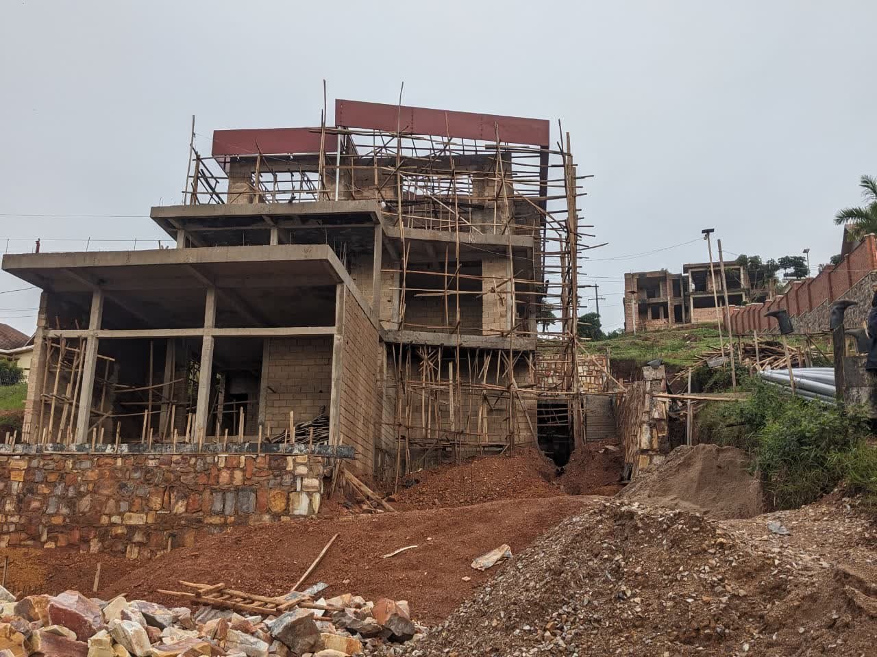 Structural progress overlooking Kigali at the Rebero hillside construction site